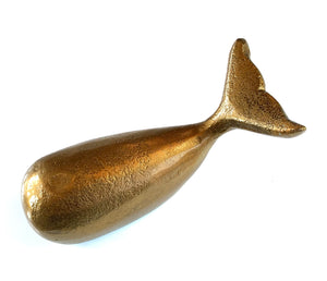 melville whale in brass